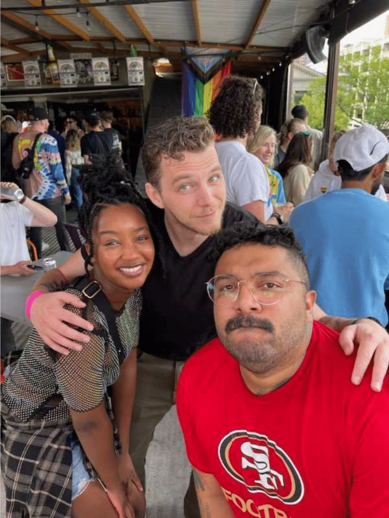 Three avalanche employees posing for group photo